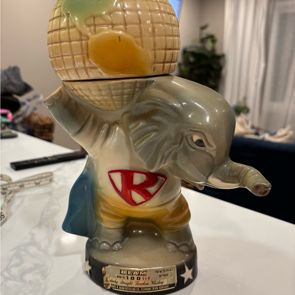 Vintage Jim beam decanter with elephant holding the world. Late 60s. Republican